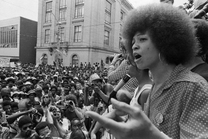 04 Jul 1974, Raleigh, North Carolina, USA --- Radical political activist Angela Davis speaks at a street rally in Raleigh. --- Image by © Bettmann/CORBIS