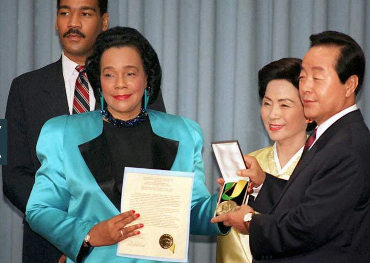 South Korean President Kim Young-Sam (R), accompanied by his wife Son Miang-Sun (2nd R), receives the Martin Luther King, Jr. Nonviolent Peace Prize from Coretta Scott King (2nd L), during a ceremony held in Seoul on January 26, 1995. 